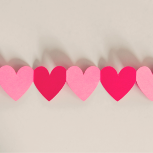 cut out hearts next to each other for a single on valentines day post